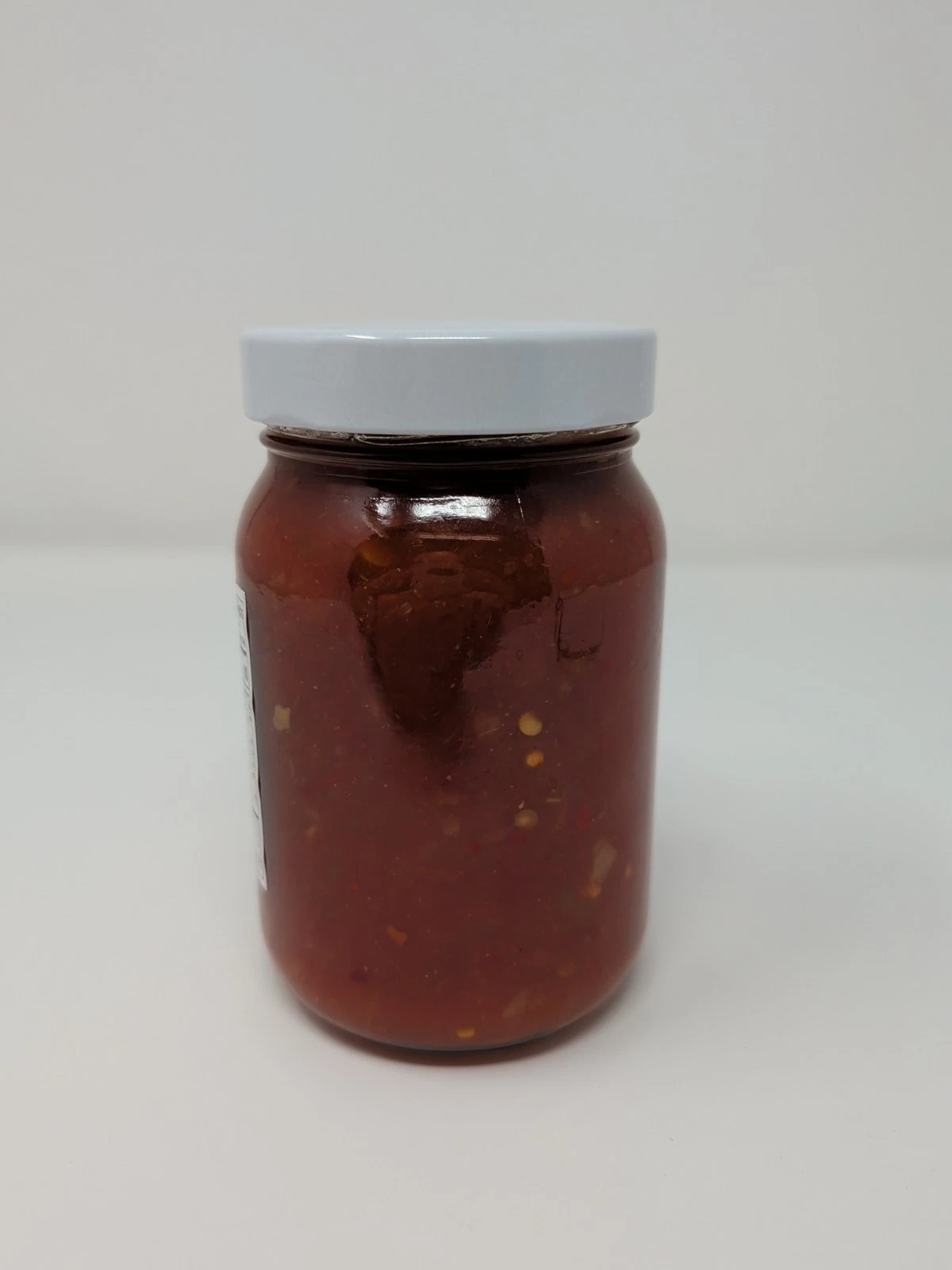 Hell on the Red Hot Party Dip glass jar on a white background