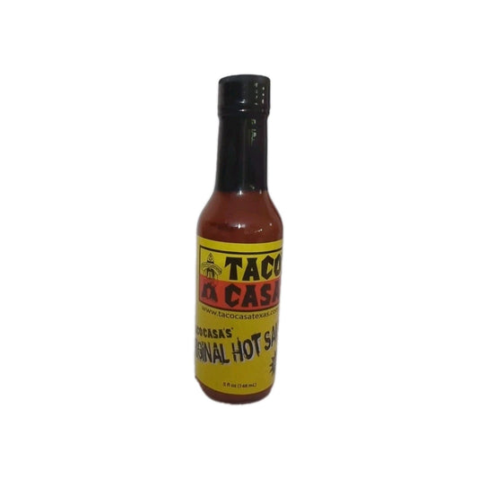 Bottle of Taco de Casa hot sauce on a white background