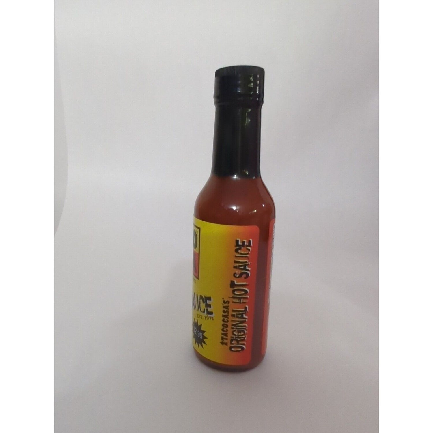 Taco Casa Hot Sauce bottle on white background