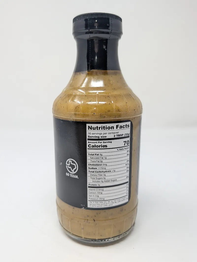 Side view of a bottle of Butler's Texas Gold Gourmet BBQ Sauce on a plain white background featuring Nutrition Facts. The bottle is filled with a golden-brown sauce and features a black label with white and yellow text.