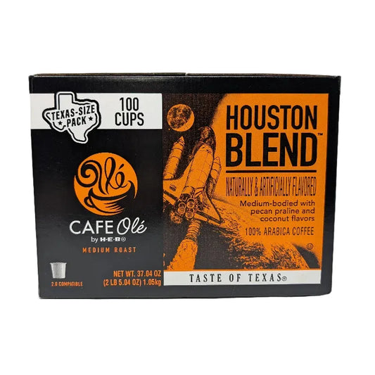 Front view of Cafe Ole by HEB Houston Blend coffee box, a Texas-size pack of 100 K-Cups, featuring a black and orange design with a space shuttle graphic.