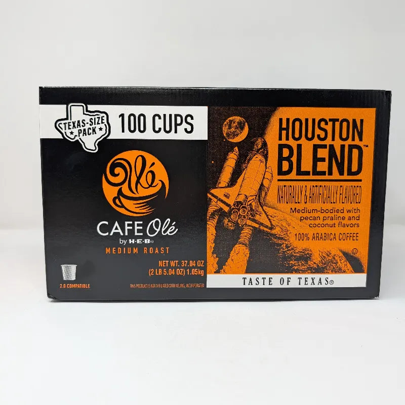 Side view of Cafe Ole by HEB Houston Blend coffee box, a Texas-size pack of 100 K-Cups, featuring a black and orange design with a space shuttle graphic.