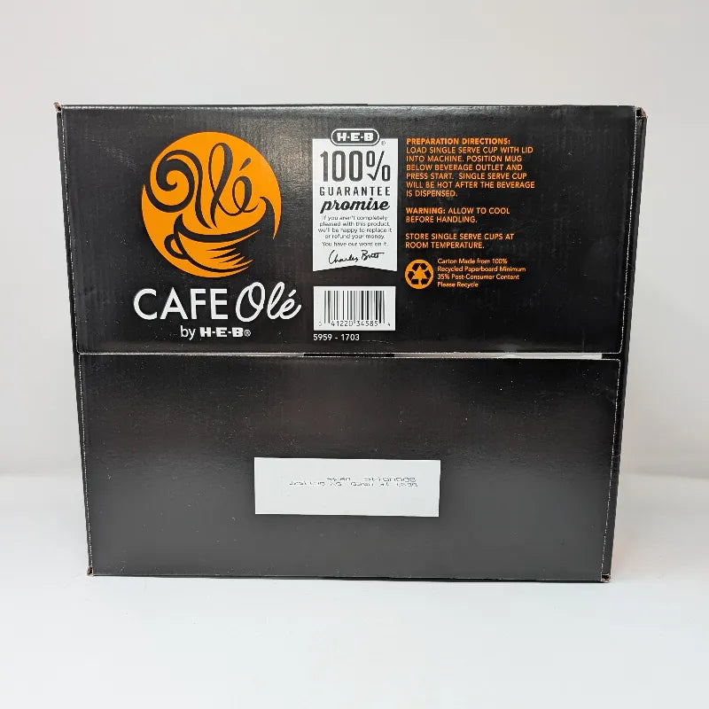 Bottom view of a box of Cafe Ole by HEB Houston Blend Medium Roast coffee pods, featuring a black and orange design.