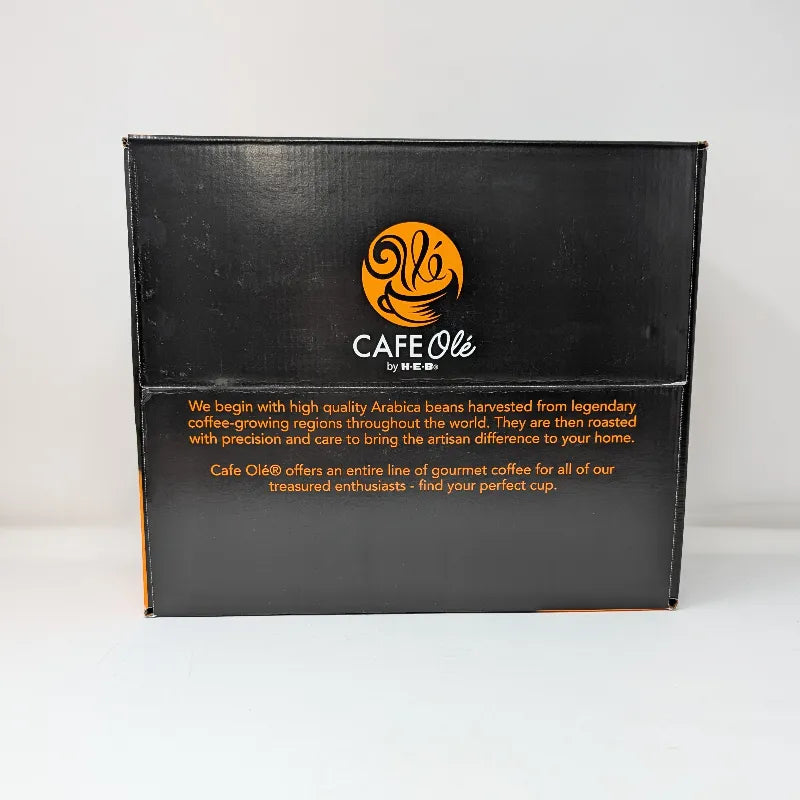 Top view of a box of Cafe Ole by HEB Houston Blend Medium Roast coffee pods, featuring a black and orange design.