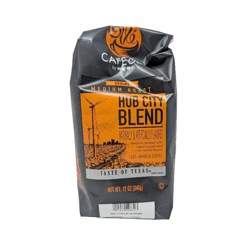 Front view of a 12 ounce bag of Hub City Blend medium roast ground coffee featuring an orange and black design scheme with a drawing of modern turbine windmills on a white background.