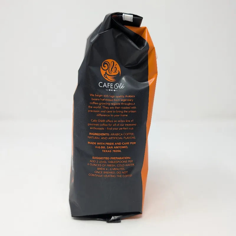 Side view of a 12 ounce bag of Hub City Blend medium roast ground coffee featuring an orange and black design scheme with an ingredients list on a white background.
