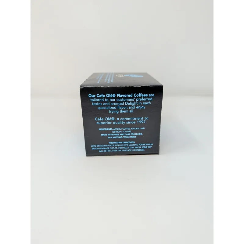 Side view of a 12 count box of Cafe Ole Texas Pecan K-Cups featuring an ingredients list in a blue and black design on a plain white background.