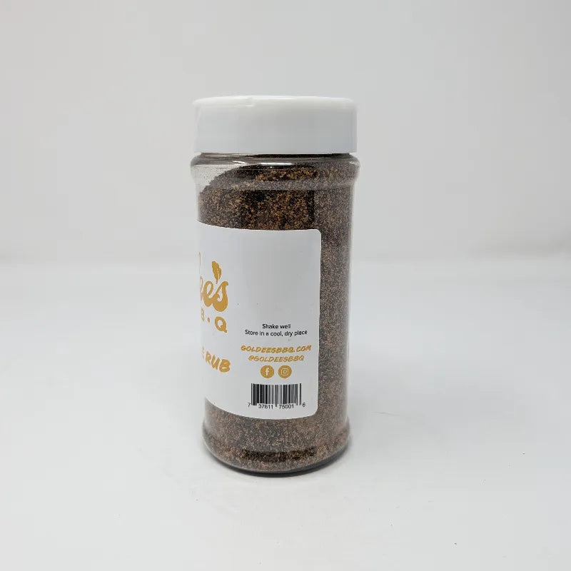 Alternate side view of a clear plastic spice jar filled with dark brown all-purpose rub, featuring a white label with gold lettering that reads 'Goldee's Bar-B-Q' and 'ALL-PURPOSE RUB'. The jar has a white plastic lid and is photographed on a solid white background.