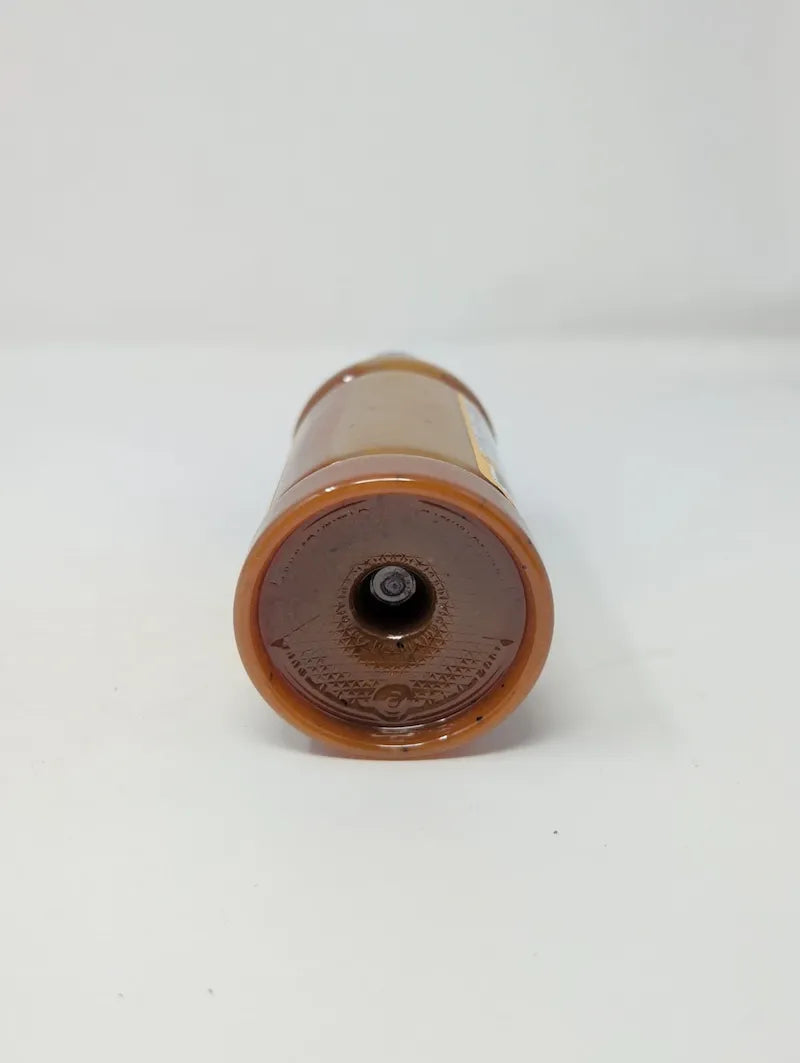 Bottom view of bottle of Goldie's Bar-B-Q Sauce on a white background