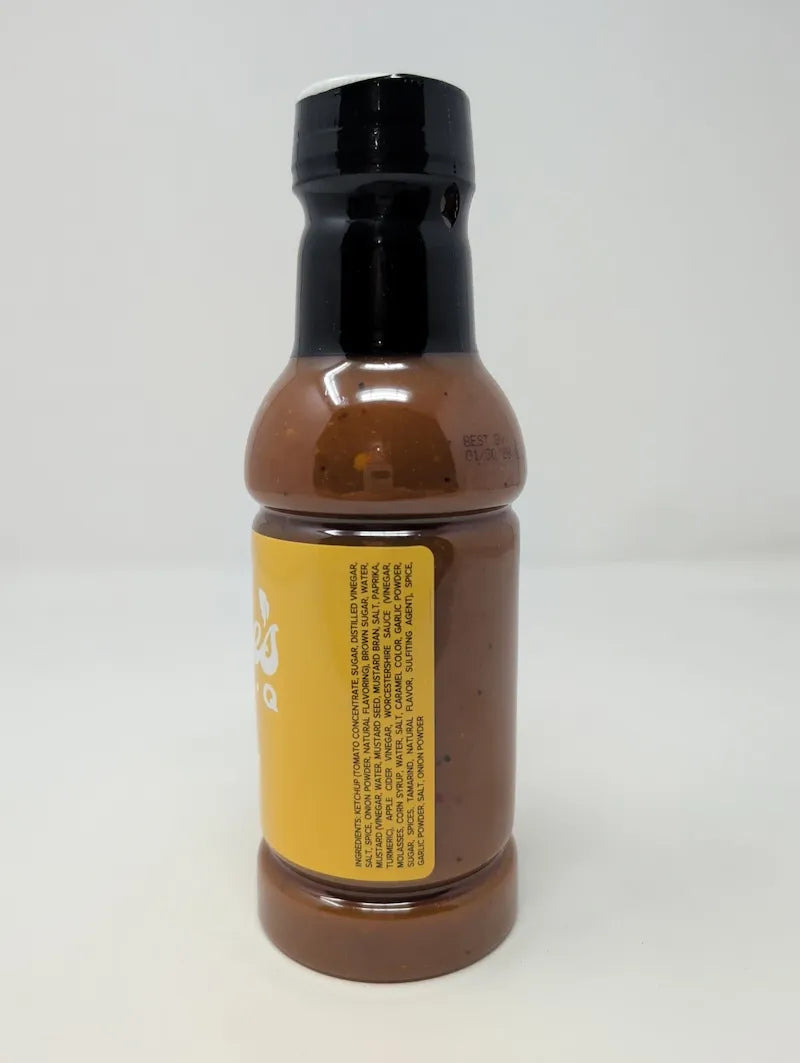 Side view of bottle of Goldie's Bar-B-Q Sauce with ingredients list on a white background