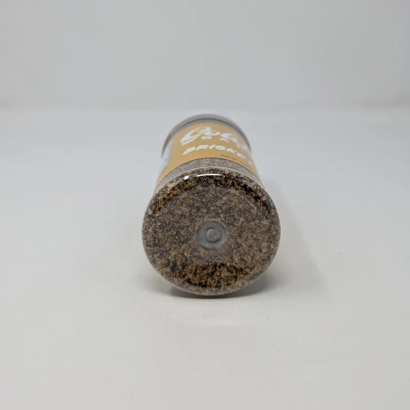 Bottom view of a shaker of Goldee's Bar-B-Q Brisket Rub featuring a yellow label with white text and a white cap on a white background.