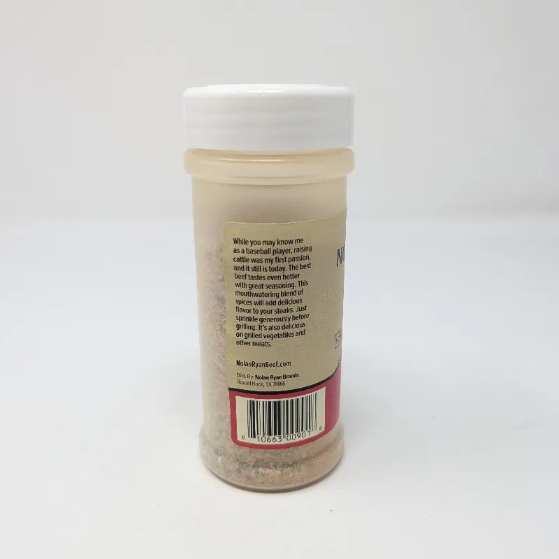 Side view of a 6 oz plastic bottle of Signature Nolan Ryan Beef Steak Seasoning with a white cap and a beige label.