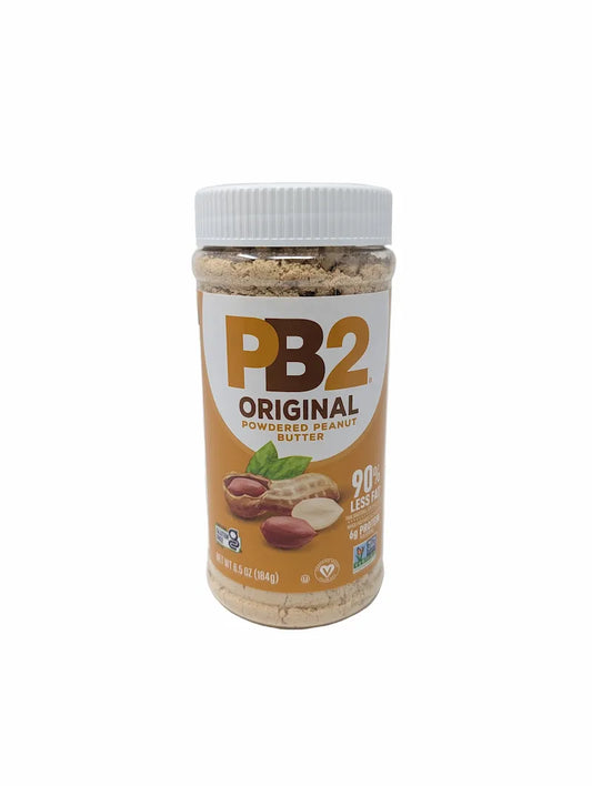 Front view of a jar of PB2 Original Powdered Peanut Butter on a plain white background. The jar has a white screw cap and a label featuring the PB2 logo in brown and orange, with illustrations of peanuts and a green leaf.