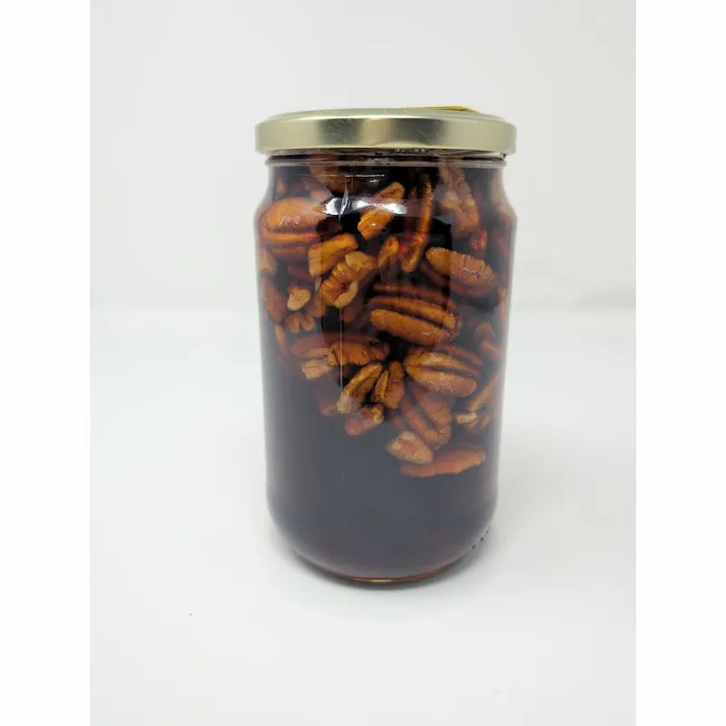 Rear view of The Great San Saba River Pecan Company Pecan Pie In A Jar on a white background