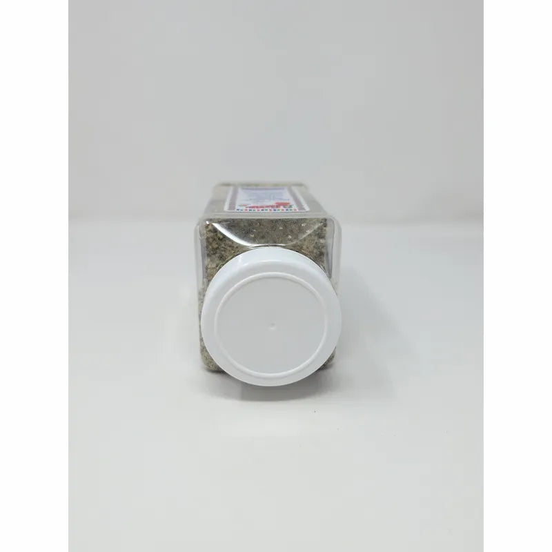 Top view of Uncle Chris Gourmet Steak Seasoning in a clear plastic shaker bottle with a white cap, on a white background.