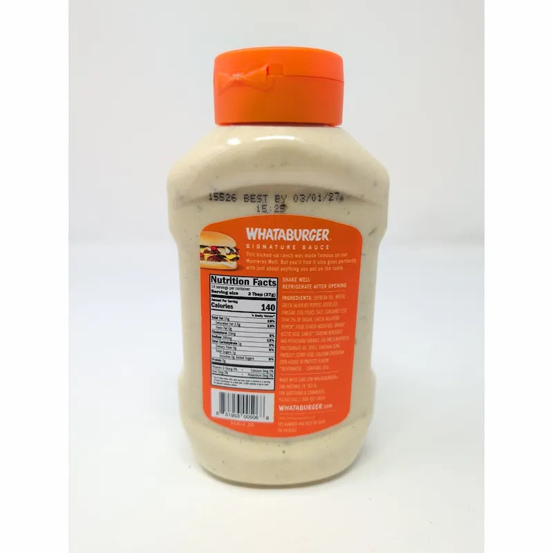 Rear view of a  bottle of Whataburger Signature Sauce with an orange cap and a white sauce inside, showing the back of the label with the brand name and nutrition facts.