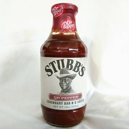 Bottle of Stubb's Dr Pepper Legendary Bar-B-Q Sauce on a white background